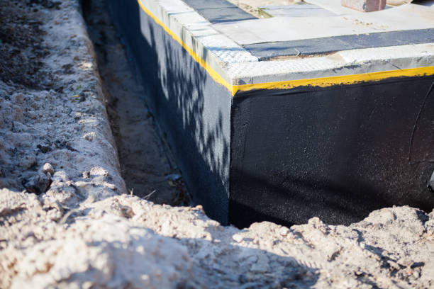 Professional Basement Waterproofing technician working in Turtletown, TN